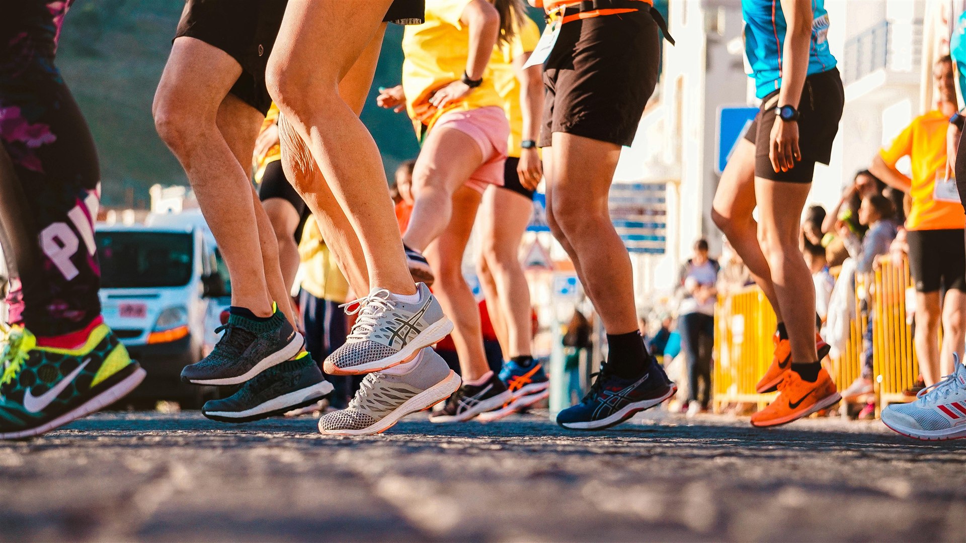 Runners gathered at a community event, stretching and socializing